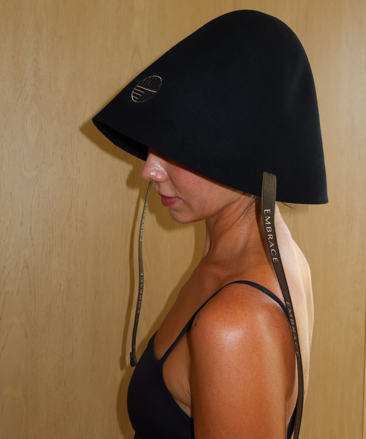 Side profile showing the oversized Sauna Hat's generous head and face coverage